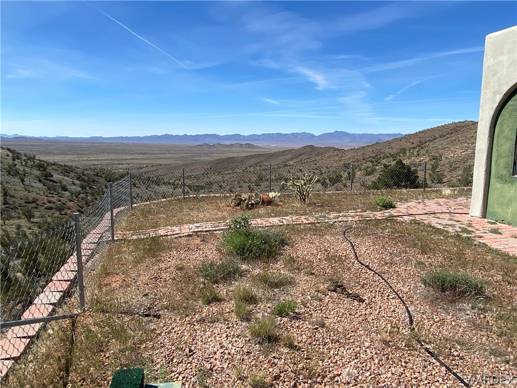 9095 Elliott Ridge Road Kingman, AZ 86401 - Photo 47 of 54 a view of a yard with an ocean beach