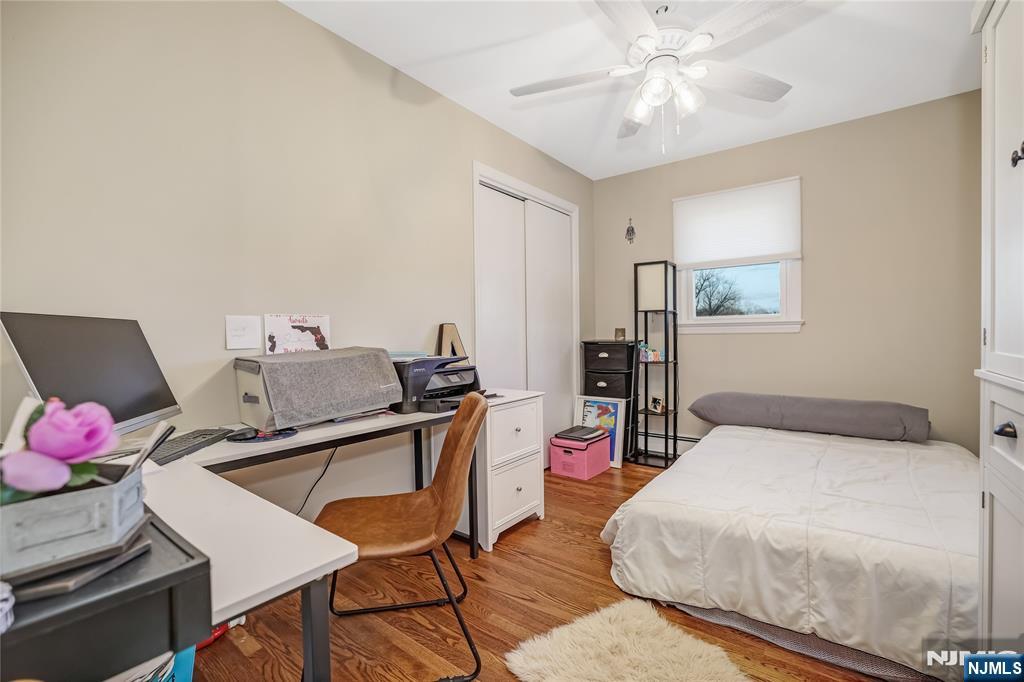 12 Maple Avenue, Unit A Waldwick, NJ 07463 - Photo 12 of 22 a bedroom with a bed and wooden floor