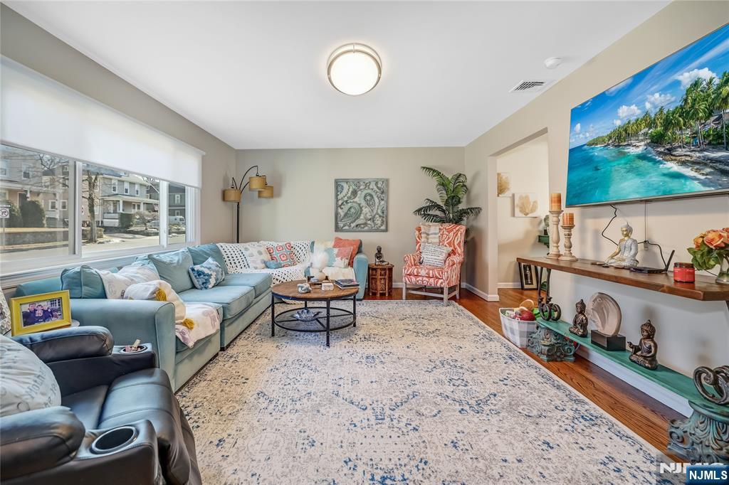 12 Maple Avenue, Unit A Waldwick, NJ 07463 - Photo 3 of 22 a living room with furniture a rug and a large window