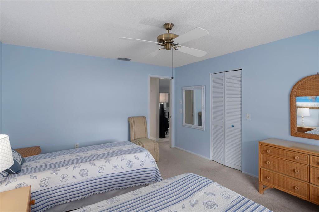6421 Pine Meadows Drive Spring Hill, FL 34606 - Photo 26 of 61 a bedroom with a bed and a dresser