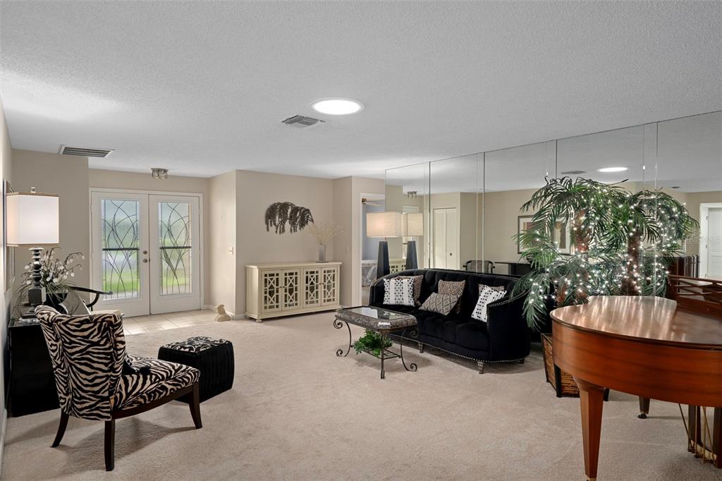 6421 Pine Meadows Drive Spring Hill, FL 34606 - Photo 6 of 61 a living room with furniture and a couch