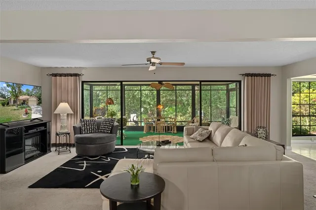 a living room with furniture fireplace and a flat screen tv