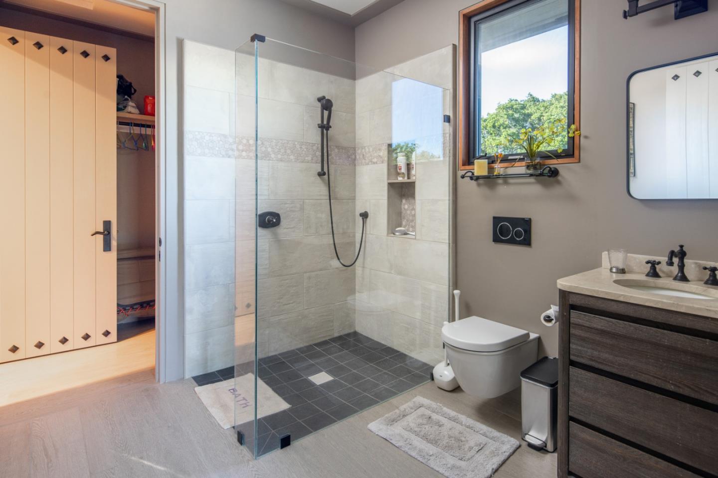 32 Potrero Trail Carmel, CA 93923 - Photo 12 of 14 a bathroom with a sink toilet a mirror and shower