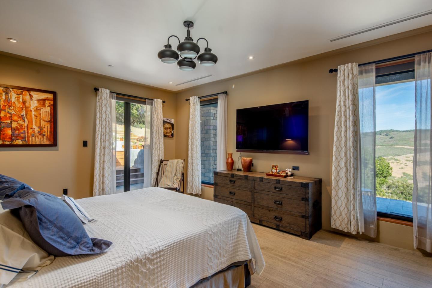 32 Potrero Trail Carmel, CA 93923 - Photo 7 of 14 a bedroom with a bed and a flat screen tv
