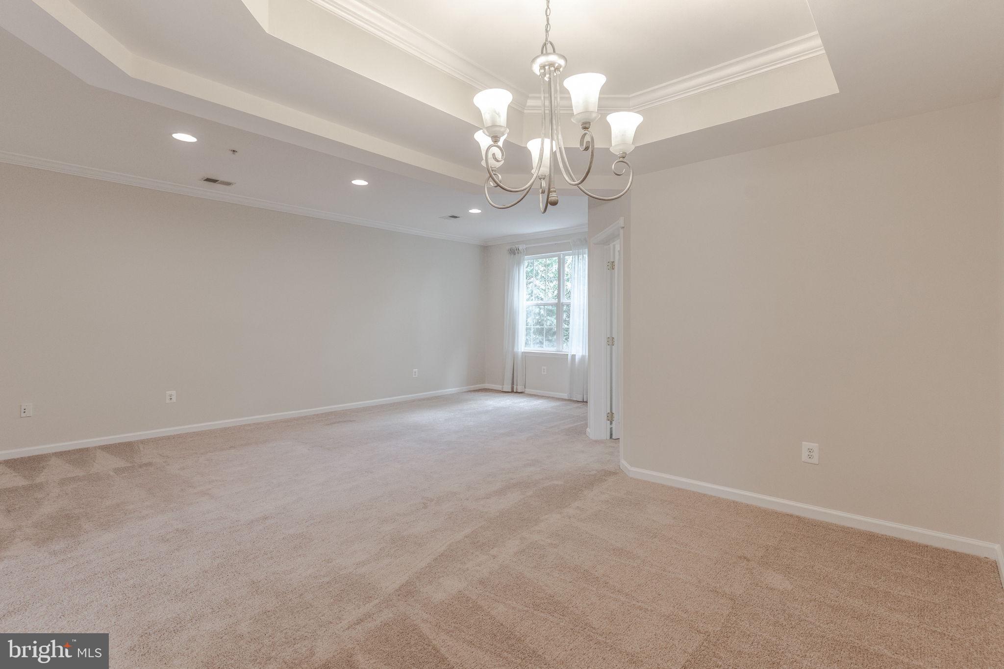 12404 B Liberty Bridge Road, Unit 12404B Fairfax, VA 22033 - Photo 20 of 43 a view of a chandelier and chandelier in a room