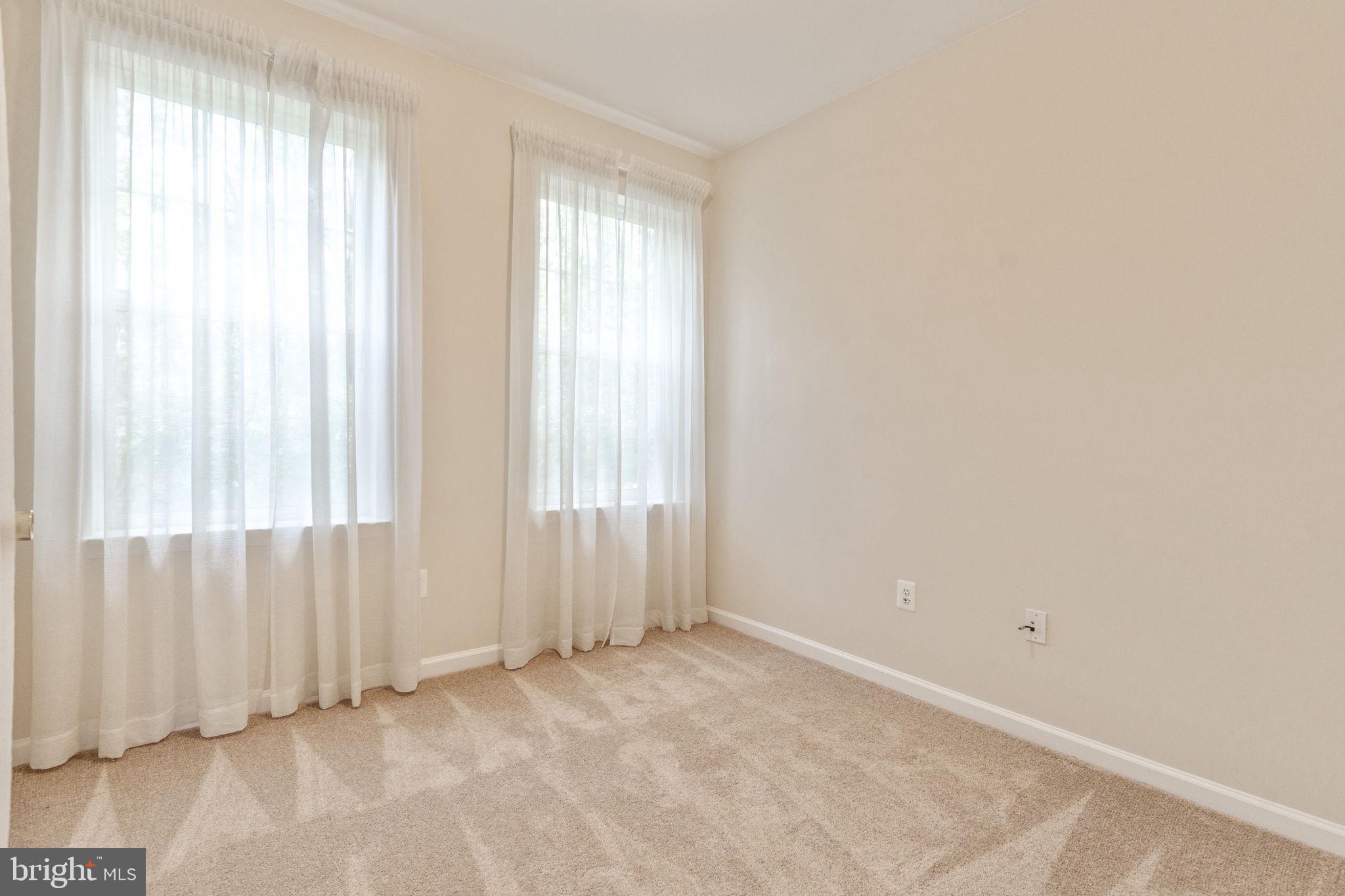 12404 B Liberty Bridge Road, Unit 12404B Fairfax, VA 22033 - Photo 23 of 43 an empty room with windows