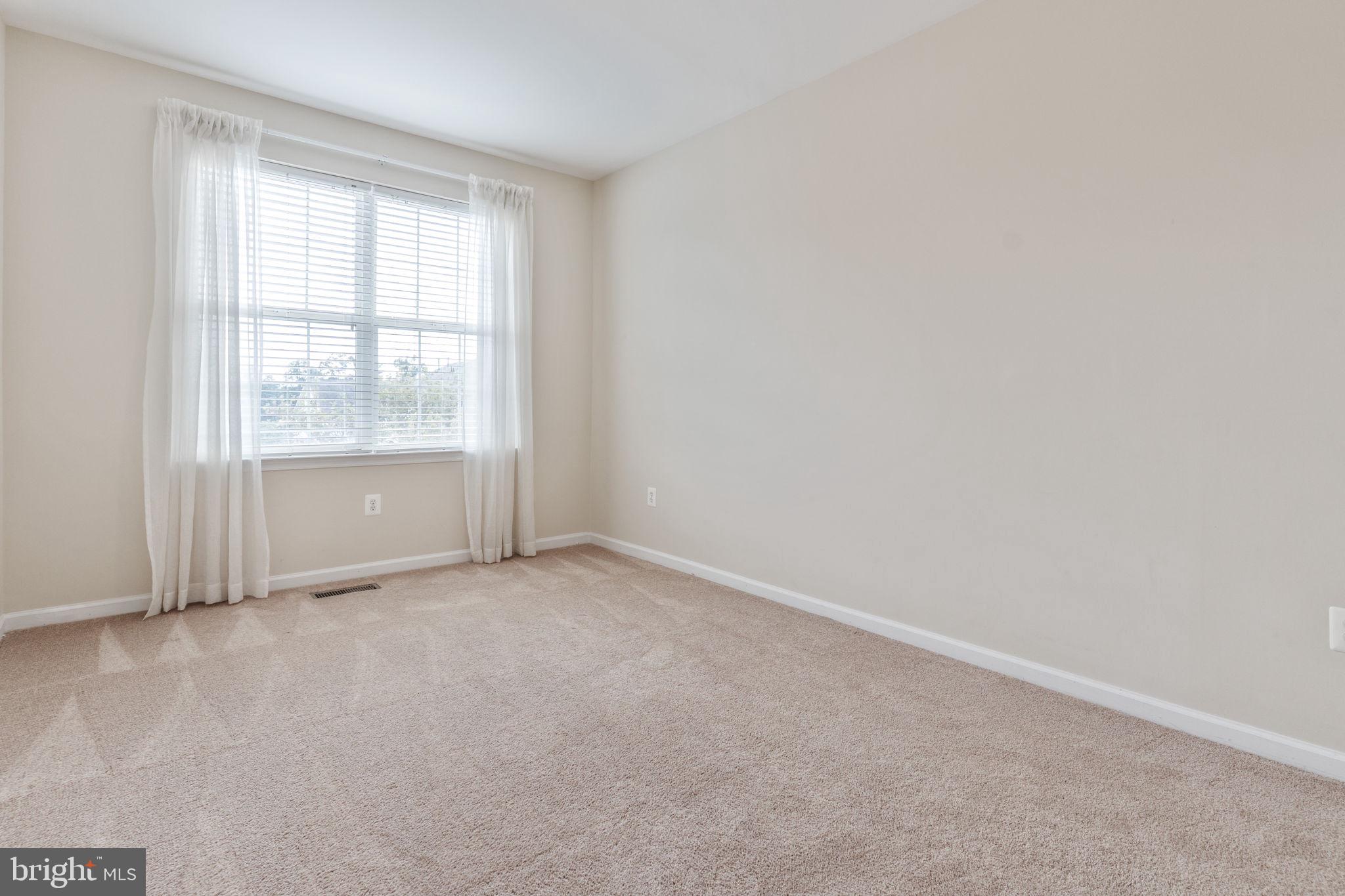 12404 B Liberty Bridge Road, Unit 12404B Fairfax, VA 22033 - Photo 25 of 43 an empty room with a window
