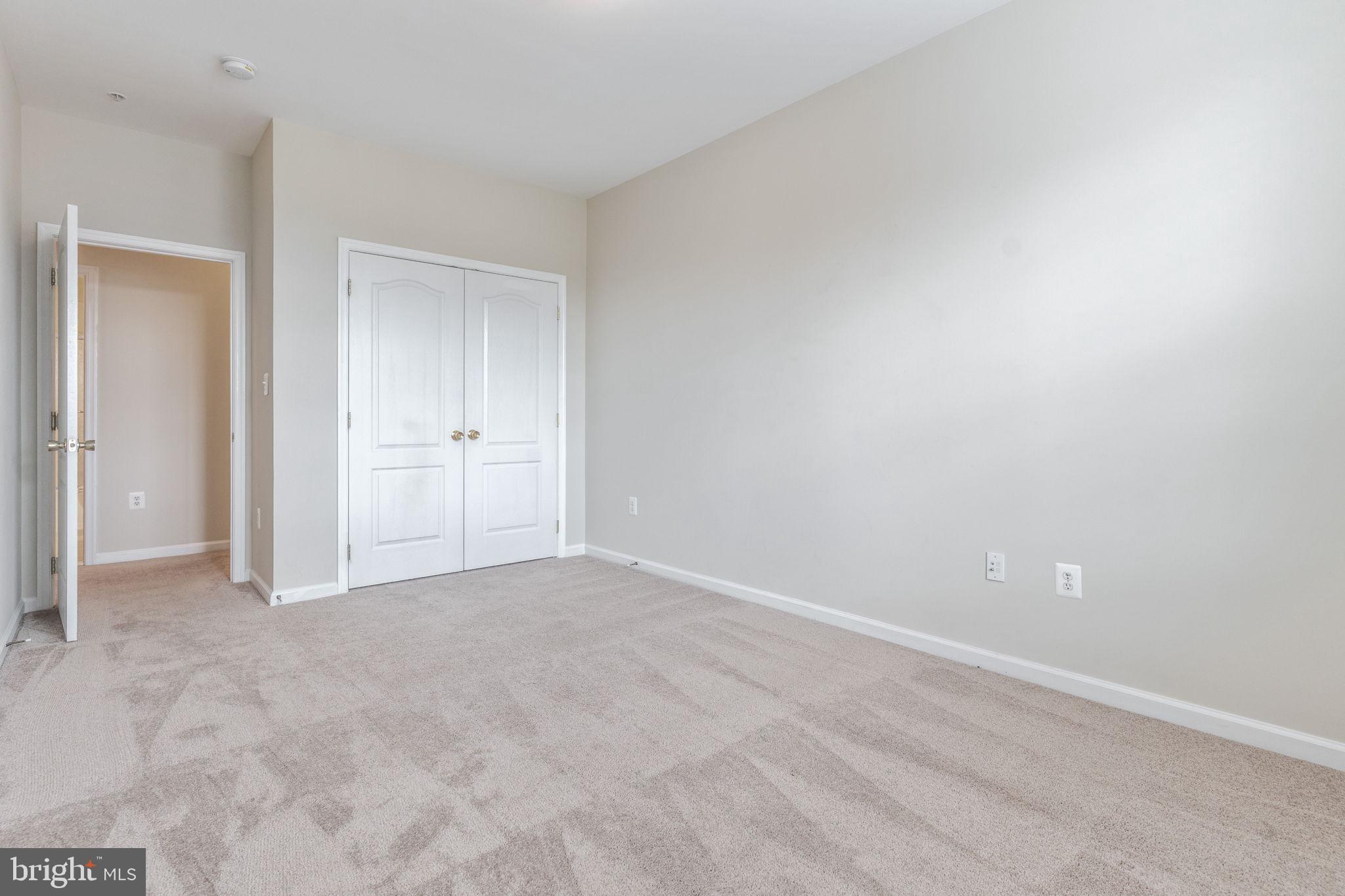 12404 B Liberty Bridge Road, Unit 12404B Fairfax, VA 22033 - Photo 27 of 43 a view of an empty room and closet area
