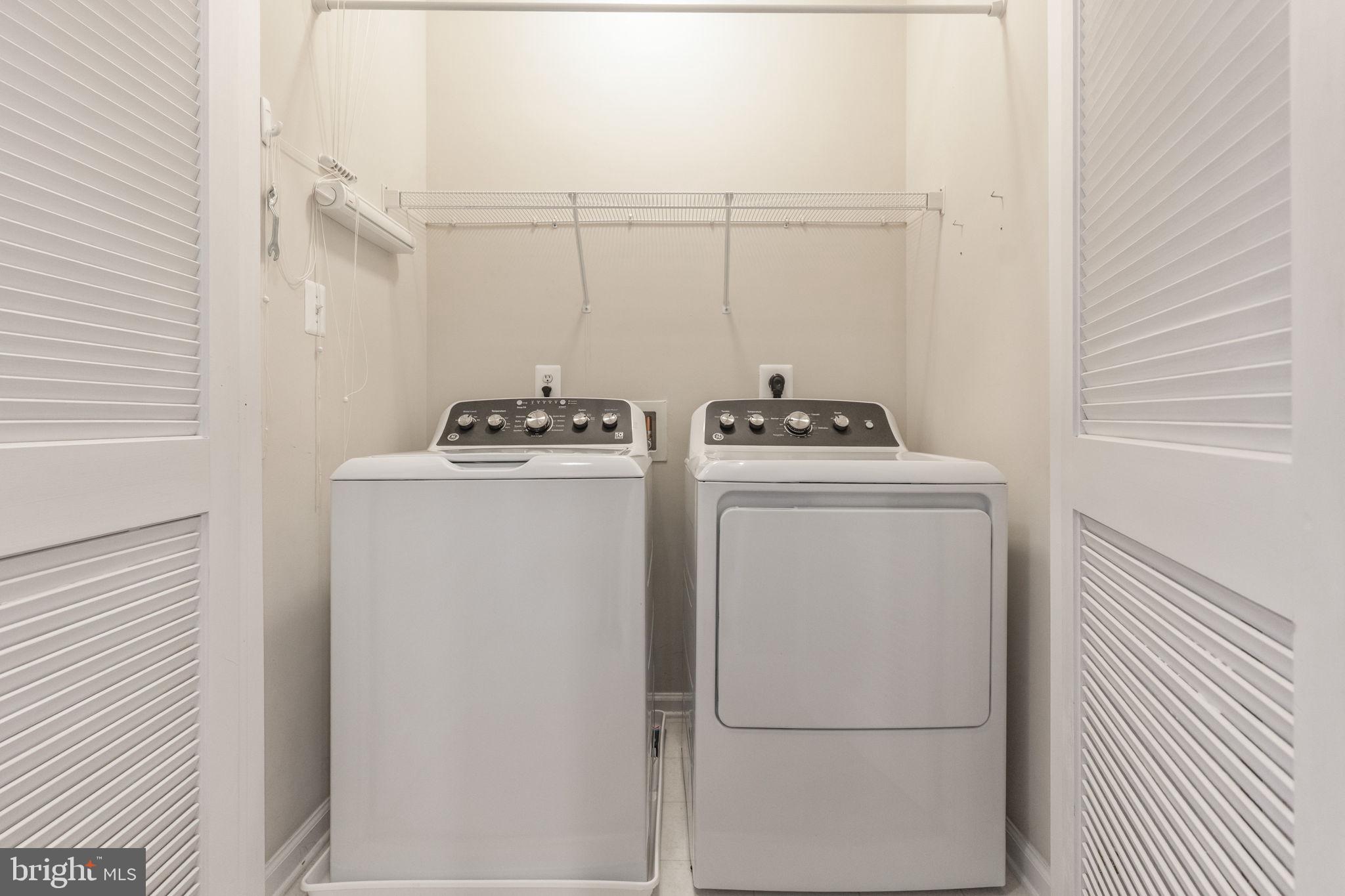 12404 B Liberty Bridge Road, Unit 12404B Fairfax, VA 22033 - Photo 31 of 43 a utility room with dryer and washer