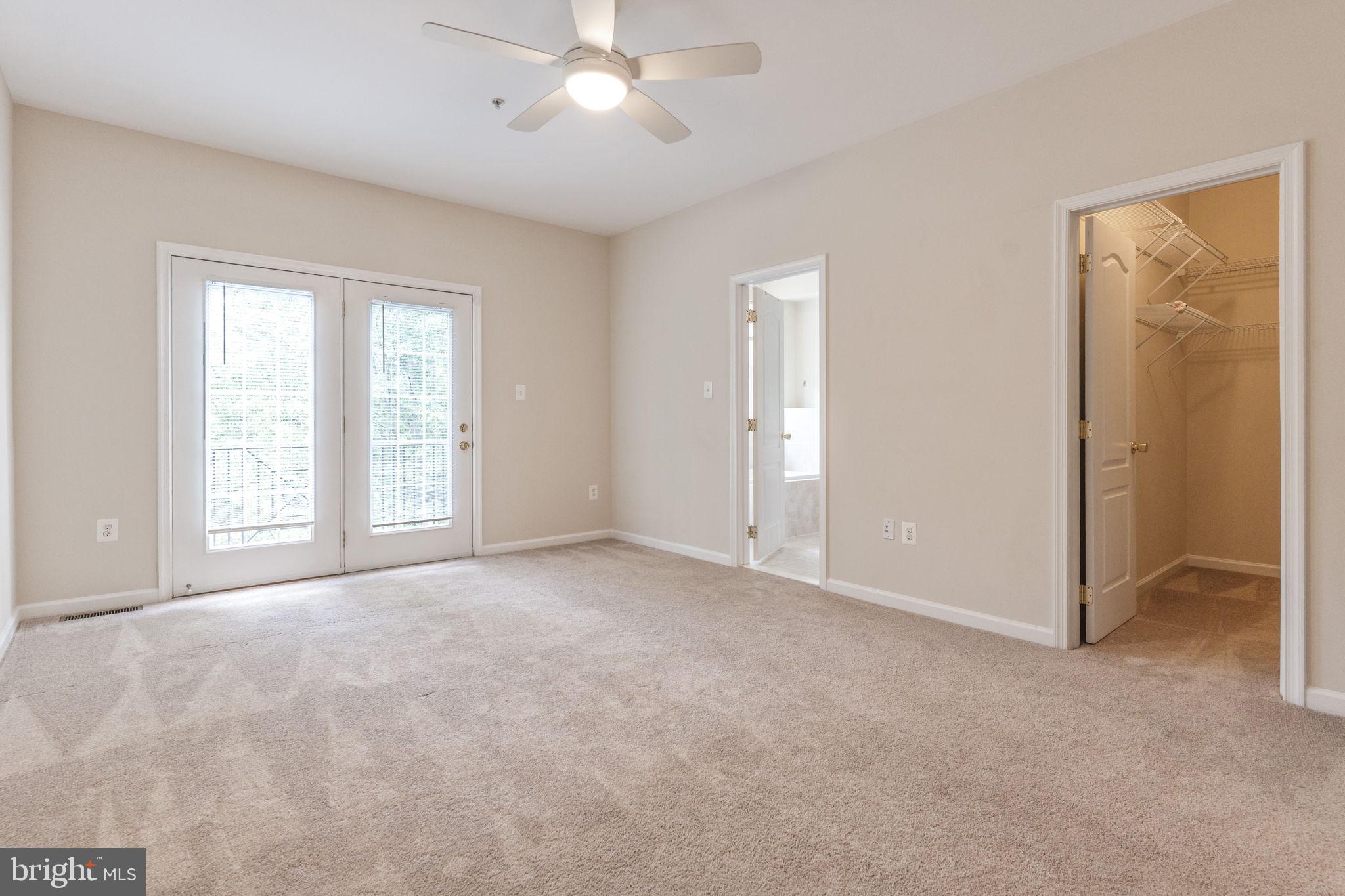 12404 B Liberty Bridge Road, Unit 12404B Fairfax, VA 22033 - Photo 33 of 43 a view of an empty room with a window