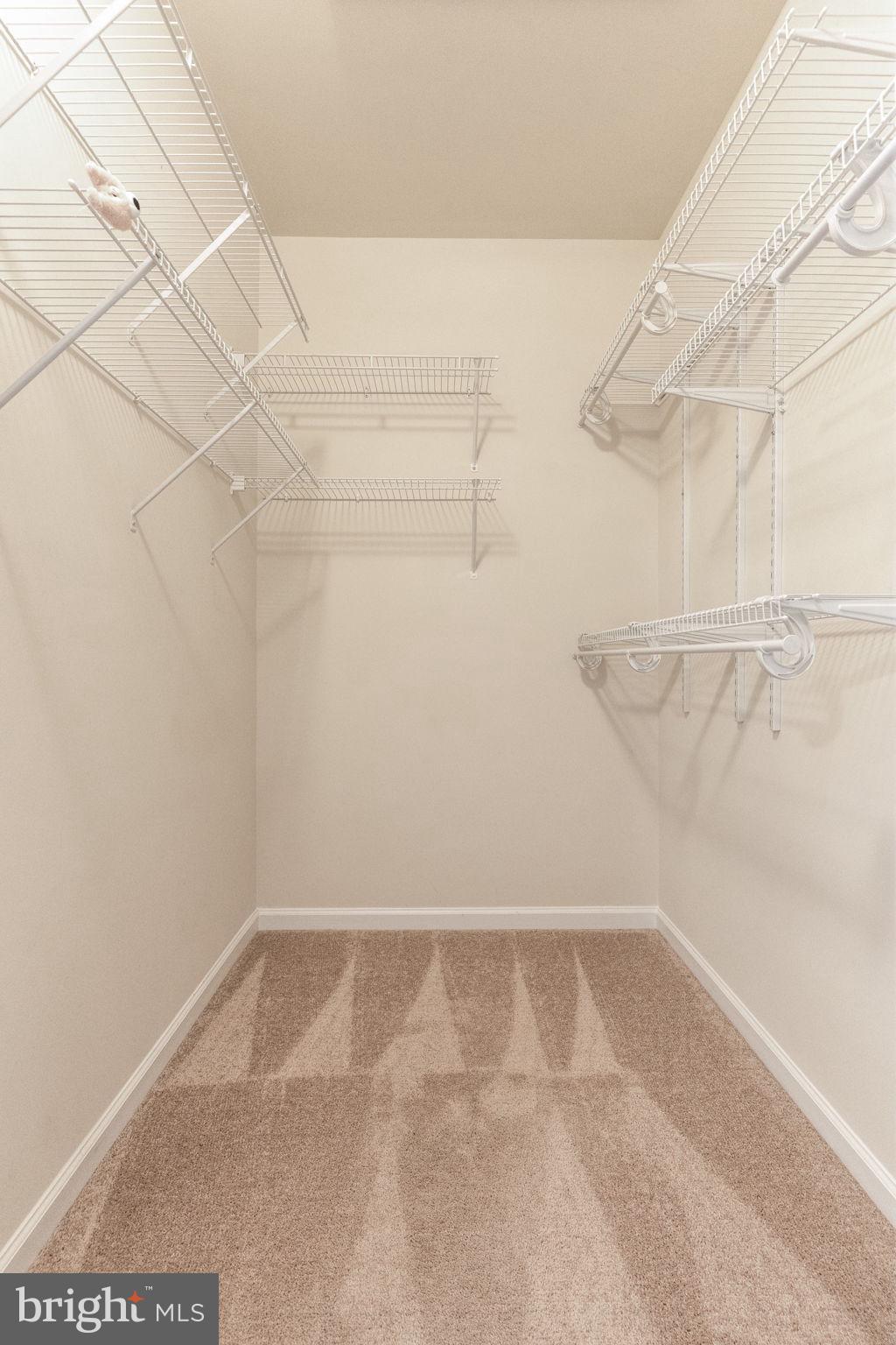 12404 B Liberty Bridge Road, Unit 12404B Fairfax, VA 22033 - Photo 39 of 43 a view of a room with racks on the wall