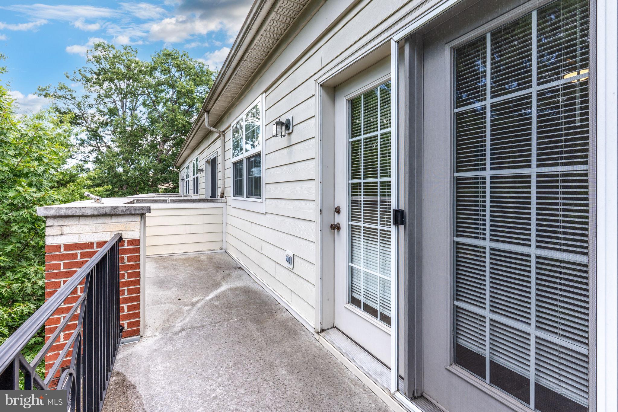 12404 B Liberty Bridge Road, Unit 12404B Fairfax, VA 22033 - Photo 40 of 43 a view of a house with a large window