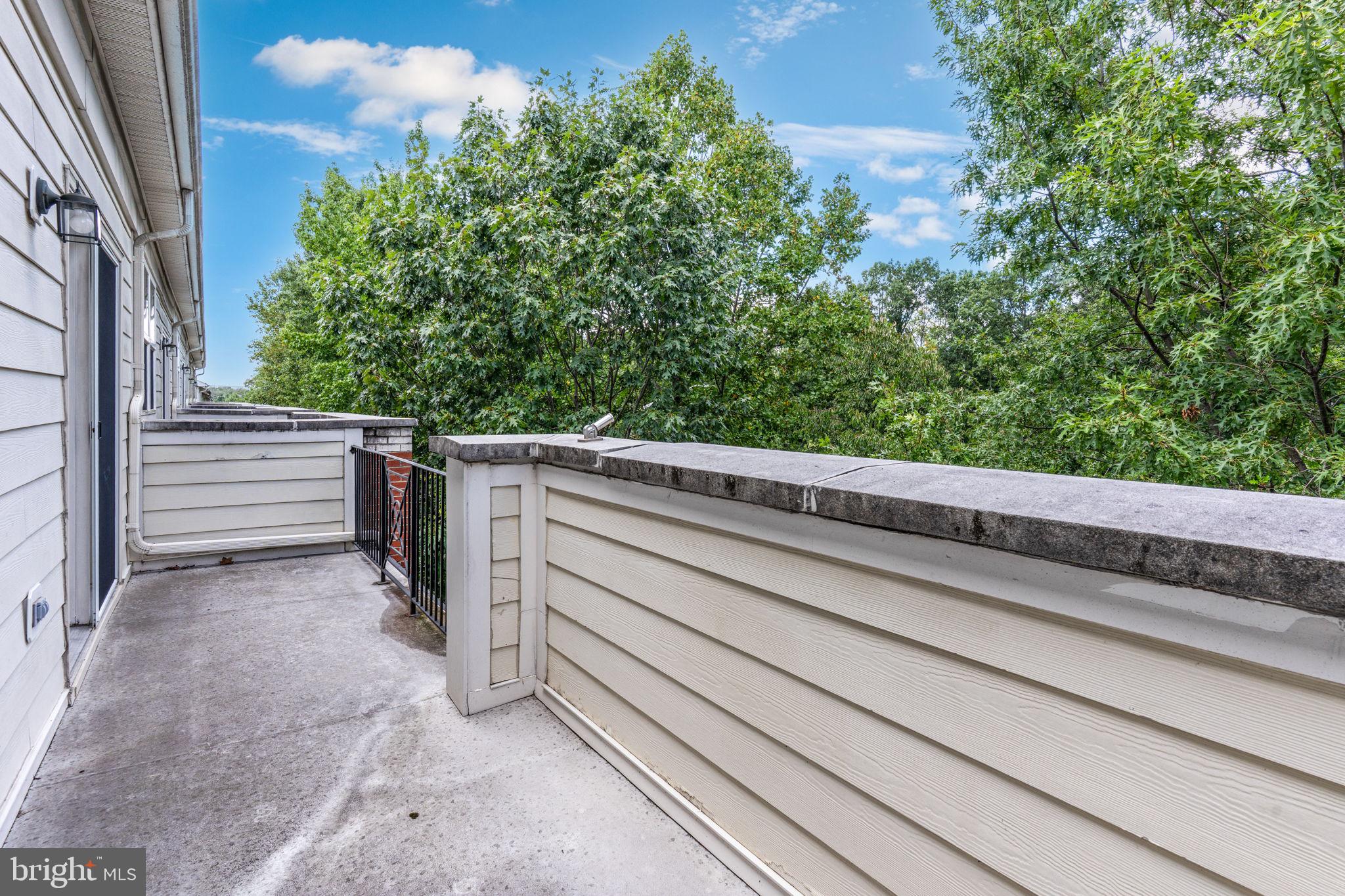12404 B Liberty Bridge Road, Unit 12404B Fairfax, VA 22033 - Photo 41 of 43 a view of a space with open kitchen