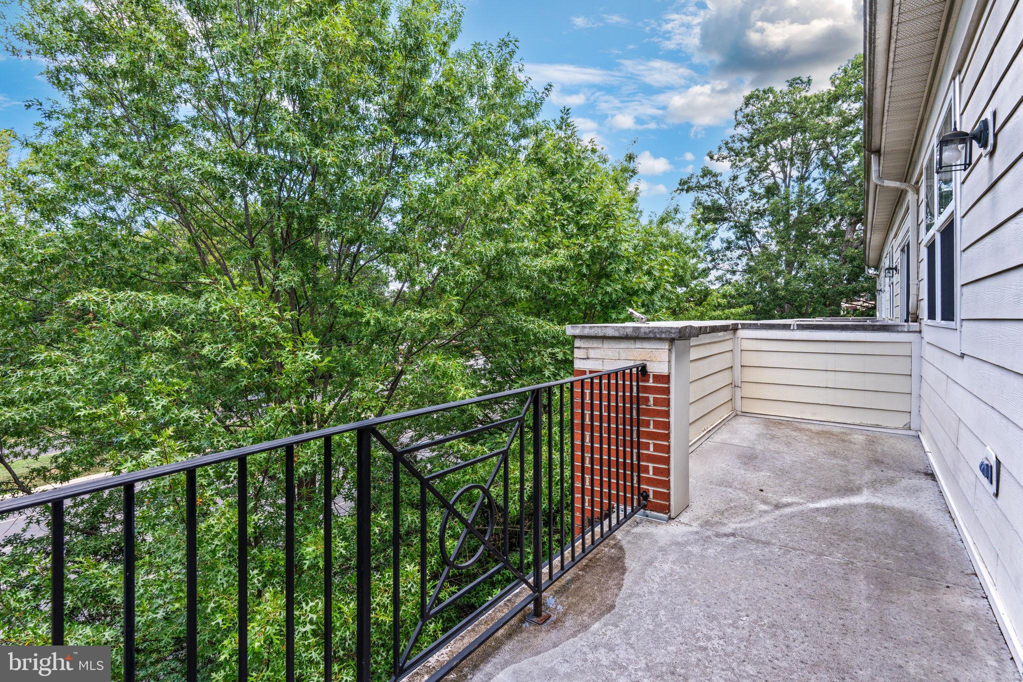 12404 B Liberty Bridge Road, Unit 12404B Fairfax, VA 22033 - Photo 42 of 43 a view of a balcony with trees