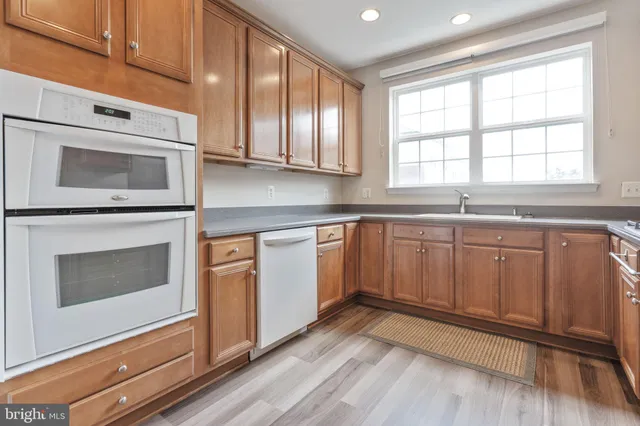 a kitchen with sink cabinets and window