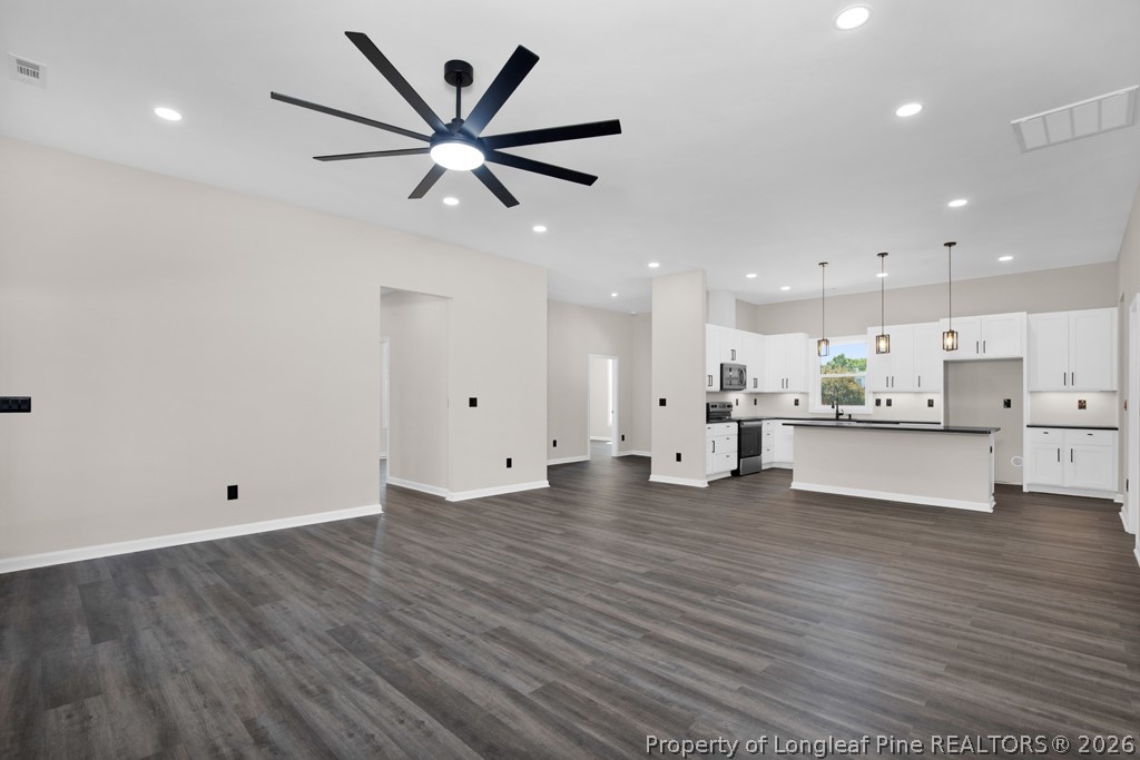 3025 Old Stage Road South Erwin, NC 28339 - Photo 11 of 50 a view of kitchen with wooden floor and window