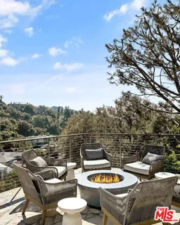 a view of a terrace with furniture and stove