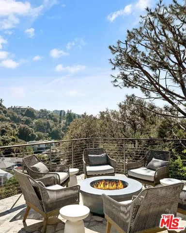 a view of a terrace with furniture and stove
