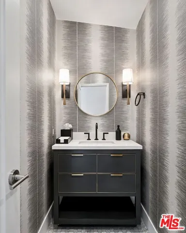 a bathroom with a sink and a mirror