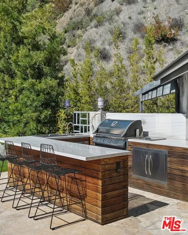 a view of balcony with furniture