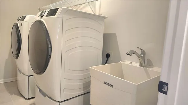 a utility room with dryer and washer