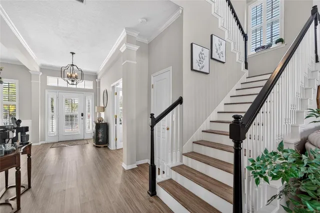 a bathroom with a granite countertop sink a mirror a and a bathtub