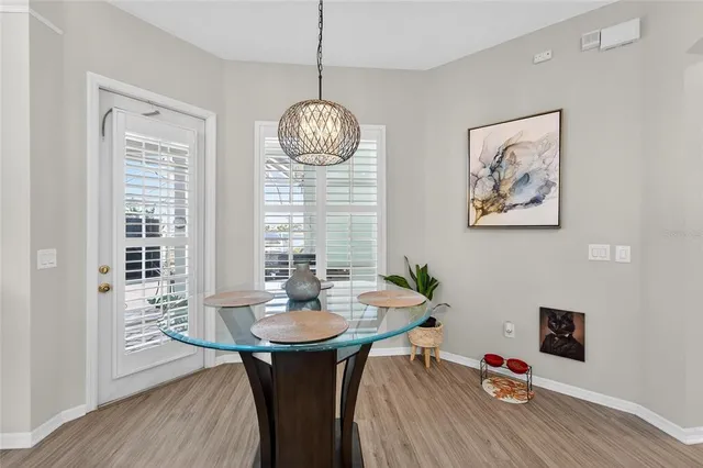 a bedroom with a bed and a tv on the dresser