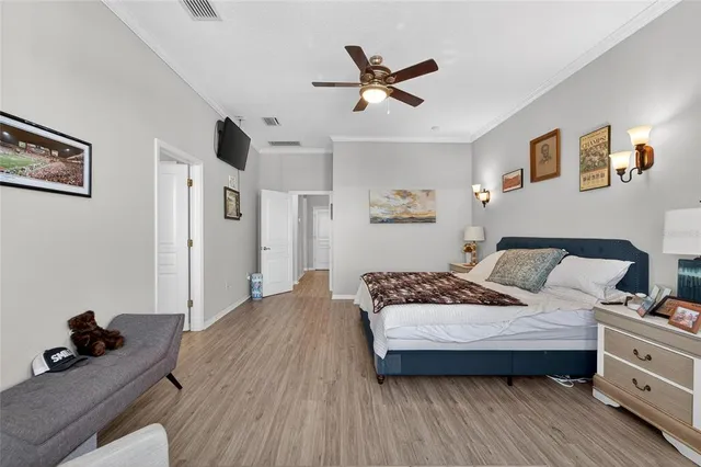 a view of a patio with couches table and chairs under an umbrella