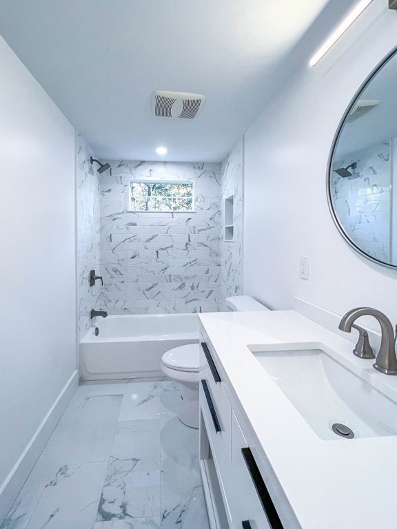 43 Oregon Road Ashland, MA 01721 - Photo 11 of 42 a bathroom with a sink a toilet and a bathtub