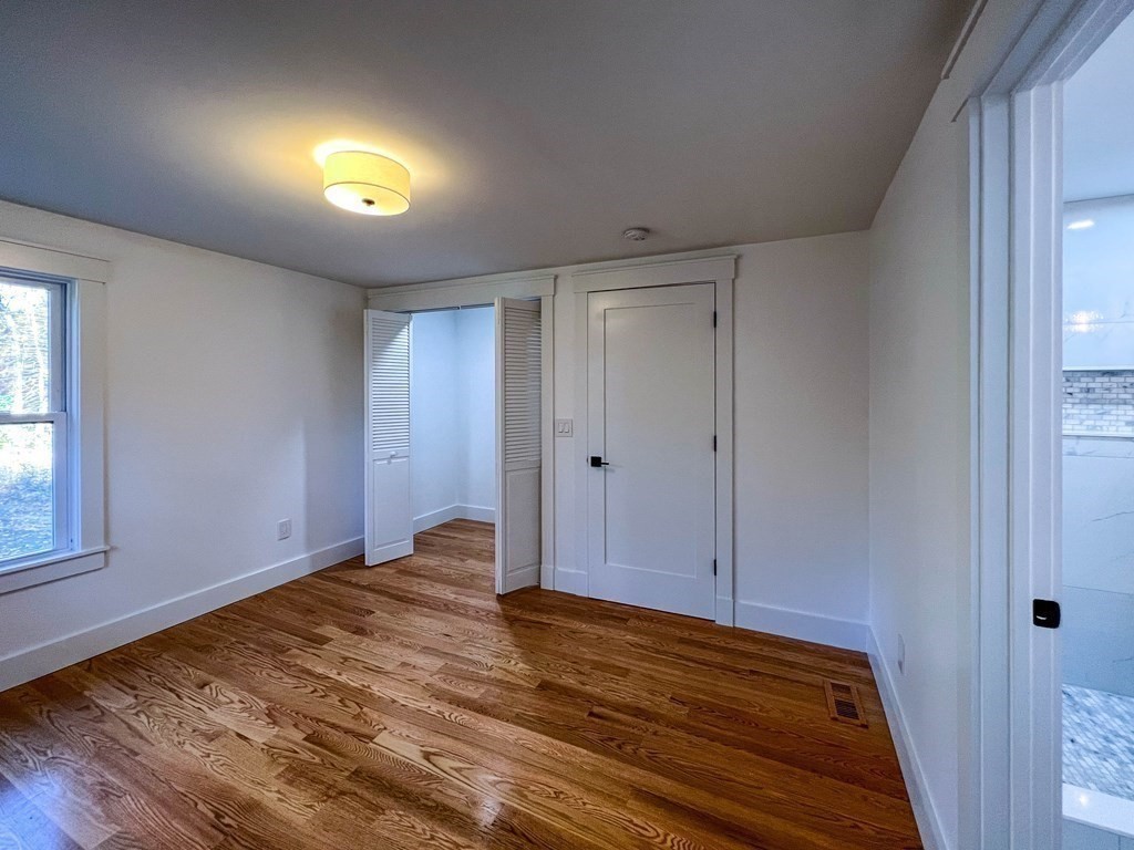43 Oregon Road Ashland, MA 01721 - Photo 16 of 42 a view of empty room with wooden floor and fan