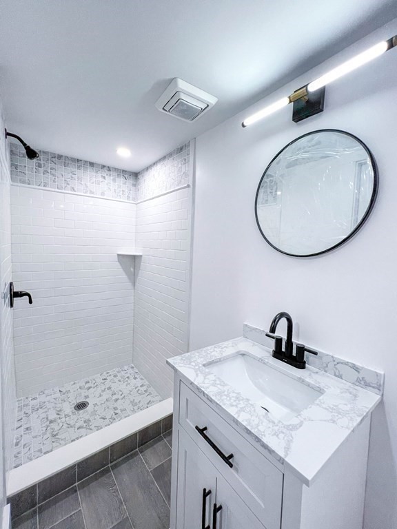 43 Oregon Road Ashland, MA 01721 - Photo 30 of 42 a bathroom with a sink a toilet and a shower