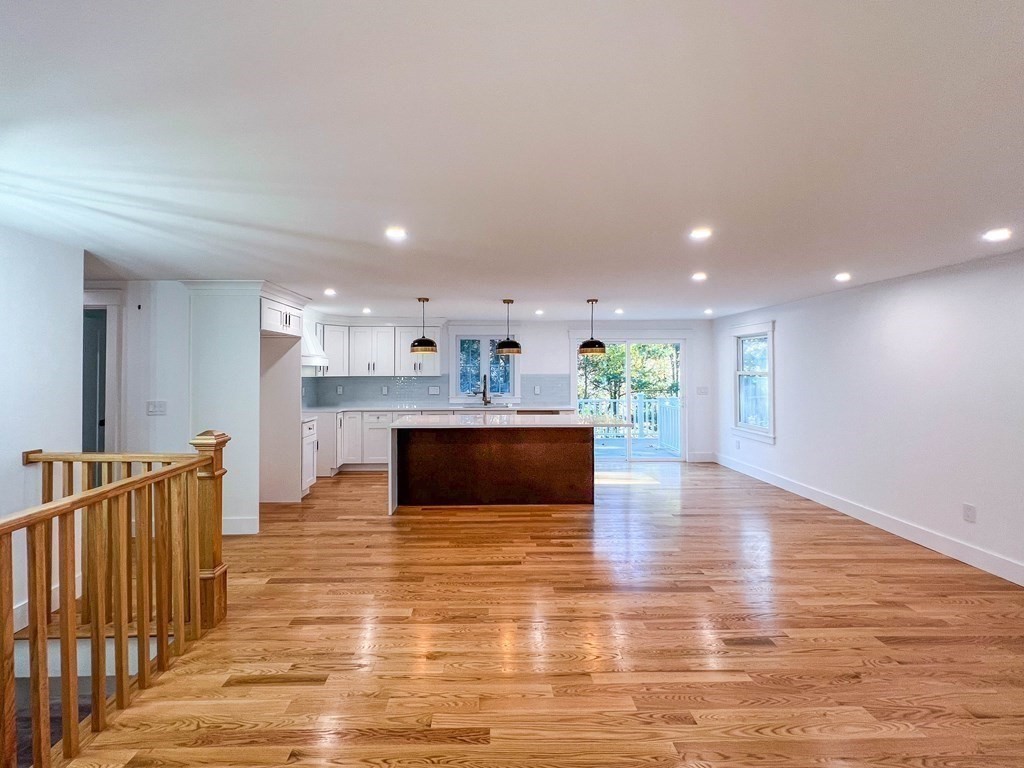 43 Oregon Road Ashland, MA 01721 - Photo 8 of 42 a view of kitchen with kitchen island microwave and wooden floor