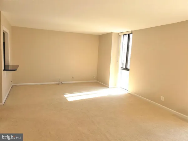 an empty room with a empty space and a window