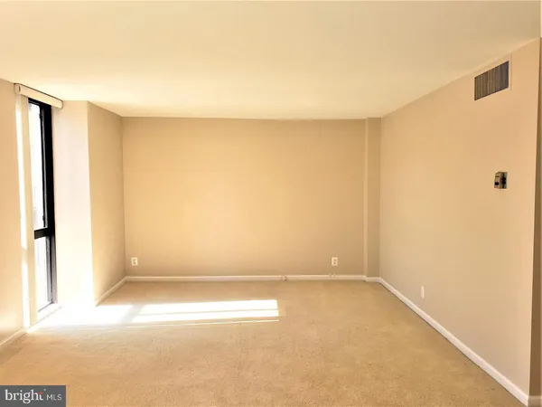 an empty room with a natural light