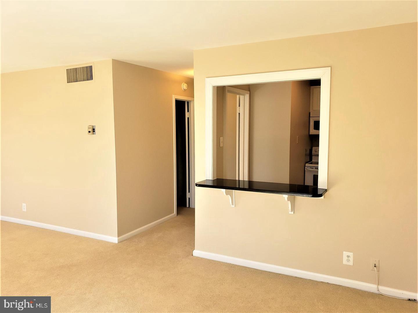 6800 Fleetwood Road, Unit 708 McLean, VA 22101 - Photo 18 of 35 Spacious, light-filled living area awaits you.