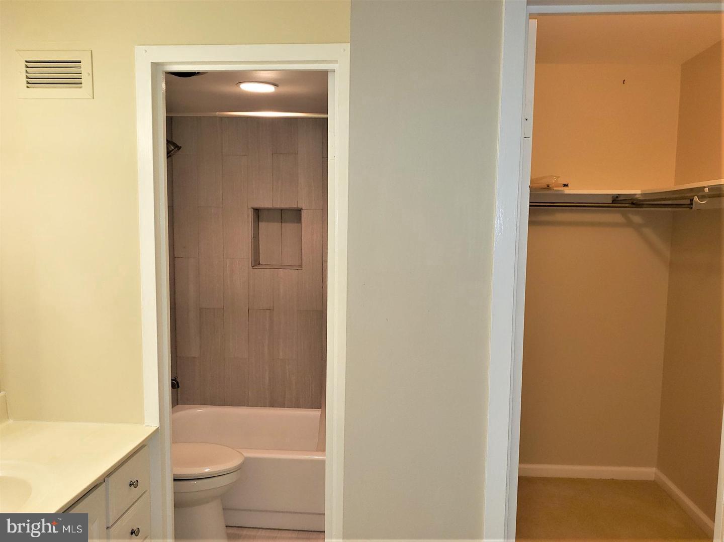 6800 Fleetwood Road, Unit 708 McLean, VA 22101 - Photo 20 of 35 Modern bathroom with spacious closet access.