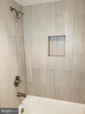 a bathroom with a sink and a shower