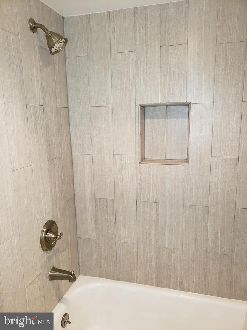 6800 Fleetwood Road, Unit 708 McLean, VA 22101 - Photo 22 of 35 Sleek shower design with modern finishes.