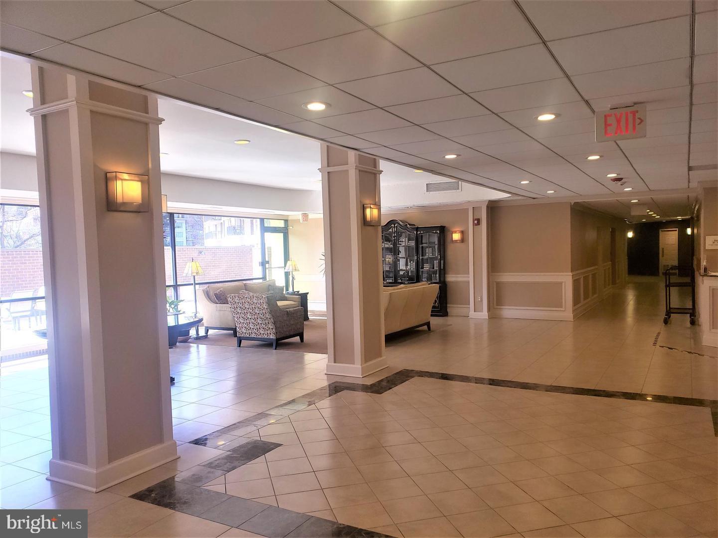 6800 Fleetwood Road, Unit 708 McLean, VA 22101 - Photo 28 of 35 Inviting lobby with natural light and elegance.