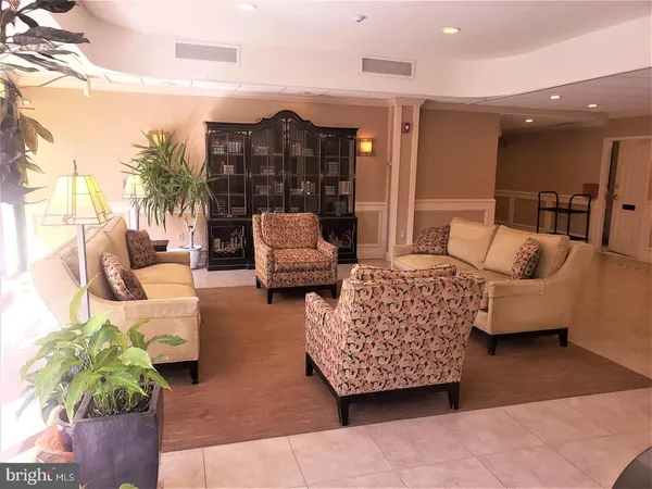 a view of a living room and chandelier or kitchen