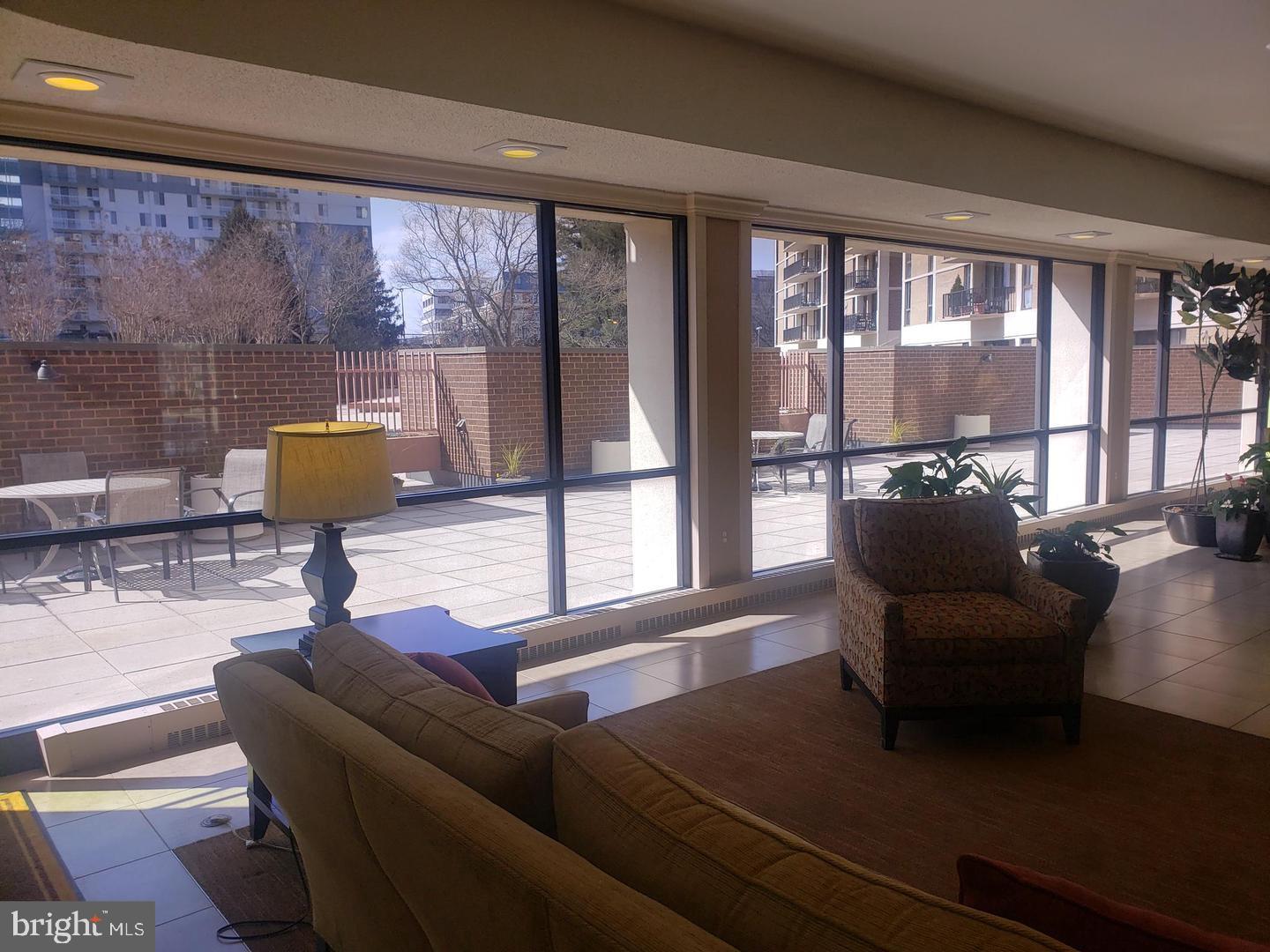 6800 Fleetwood Road, Unit 708 McLean, VA 22101 - Photo 33 of 35 Bright and airy lounge with outdoor views.