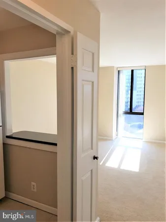 a view of a hallway with a glass door