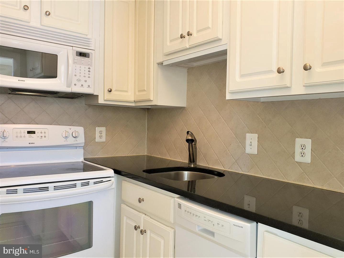 6800 Fleetwood Road, Unit 708 McLean, VA 22101 - Photo 8 of 35 Modern kitchen with sleek finishes.