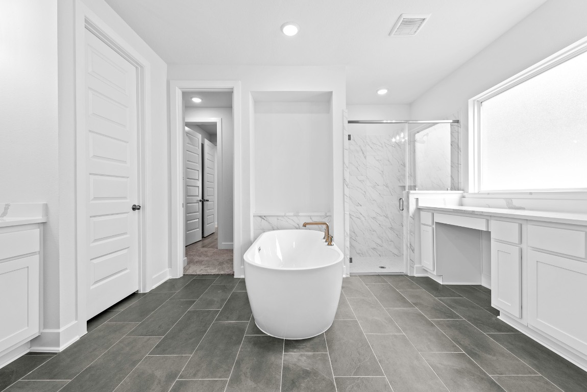 128 Meadow Beauty Lane Georgetown, TX 78633 - Photo 11 of 23 a bathroom with a sink and a mirror