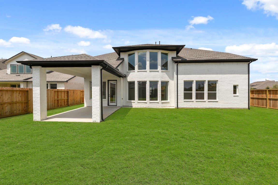 128 Meadow Beauty Lane Georgetown, TX 78633 - Photo 18 of 23 a view of an house with backyard porch and garden