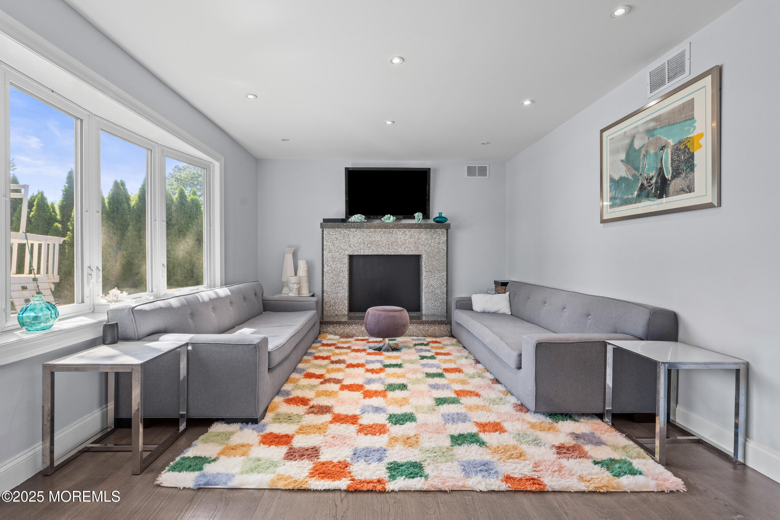 80 Cooper Avenue West Long Branch, NJ 07764 - Photo 13 of 32 a living room with furniture fireplace and a flat screen tv