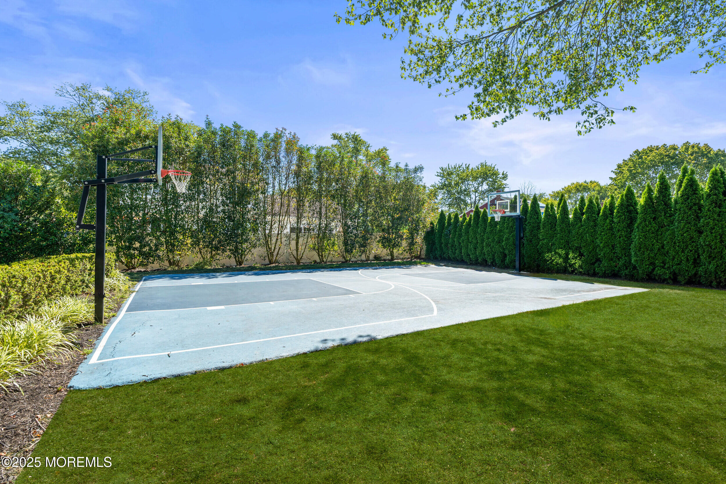 80 Cooper Avenue West Long Branch, NJ 07764 - Photo 28 of 32 a view of a yard with an trees