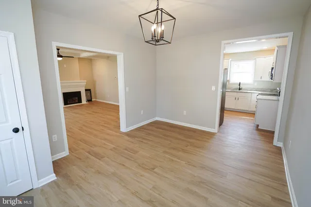 a view of a kitchen from a hallway