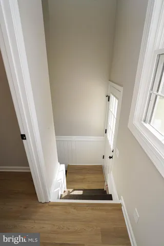 a view of entryway with wooden floor