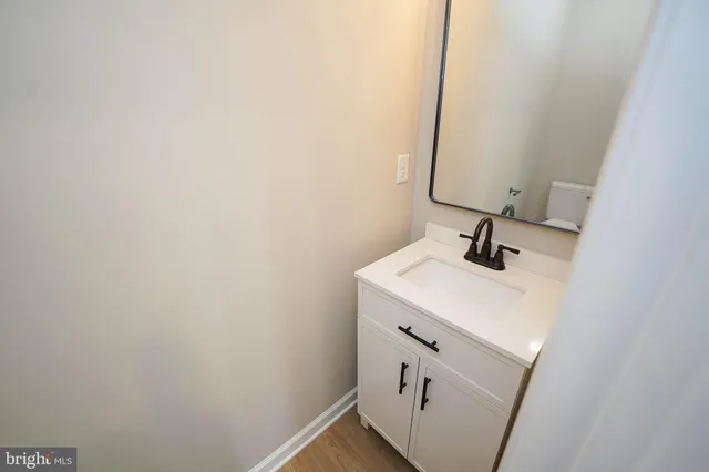 a bathroom with a sink and mirror